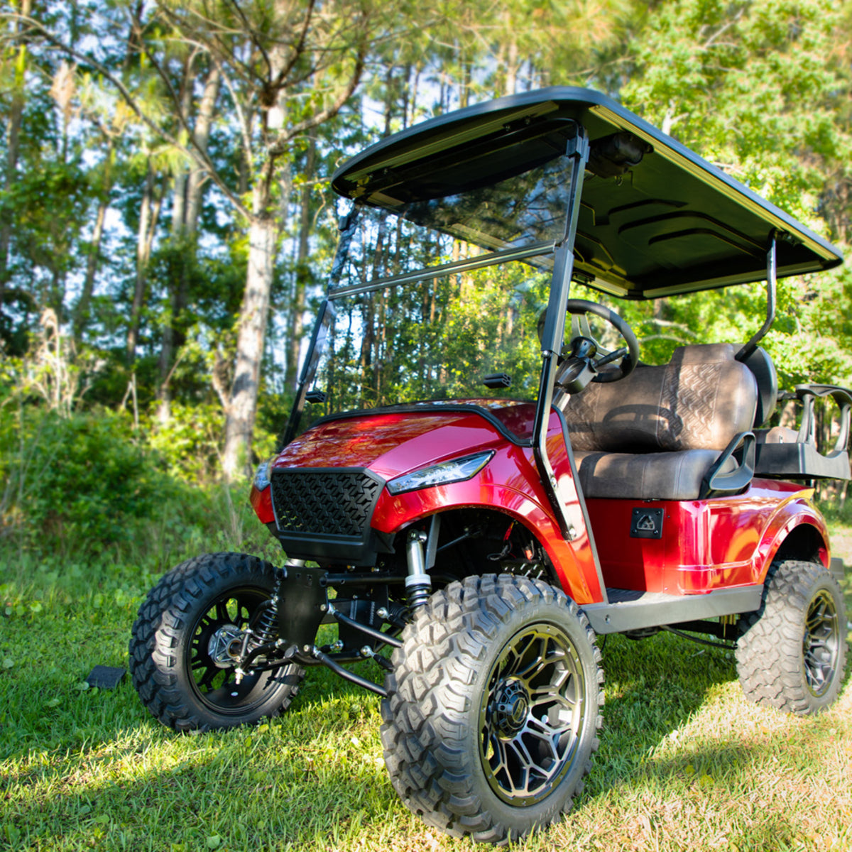 Folding Tinted 1/4" Windshield for Storm Body Kits with 3/4 Struts – installed on red golf cart